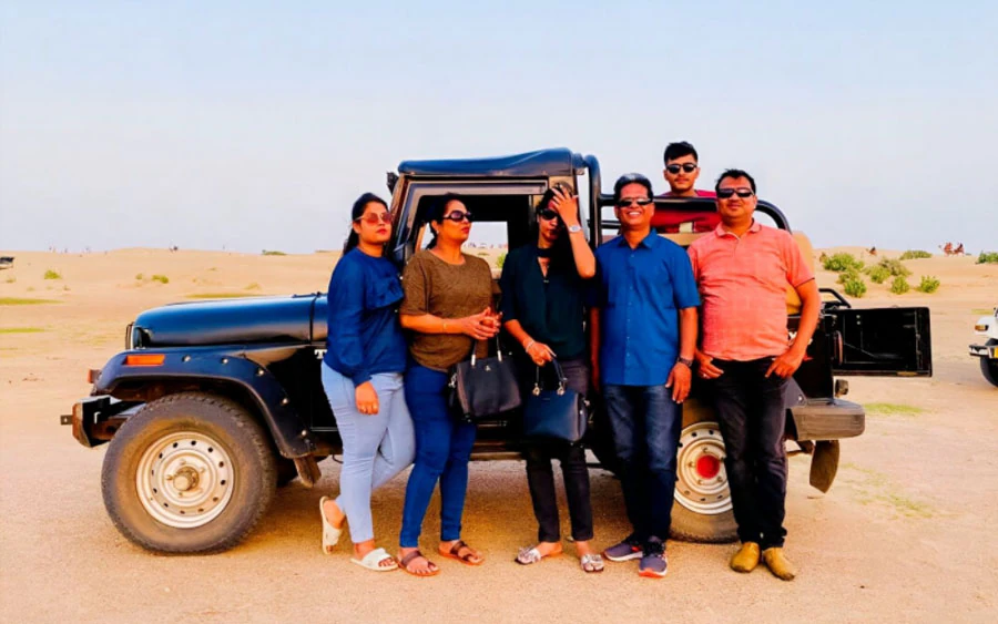 Camel safari through Sam Sand Dunes at dusk