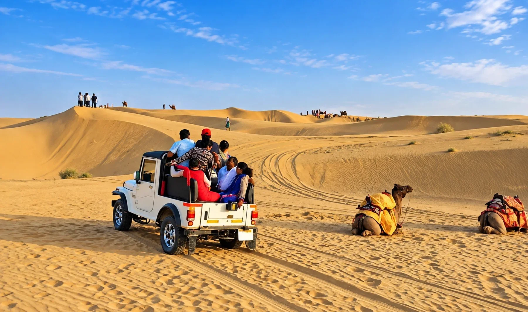 Red jeep tearing across Sam Sand Dunes at blazing sunset